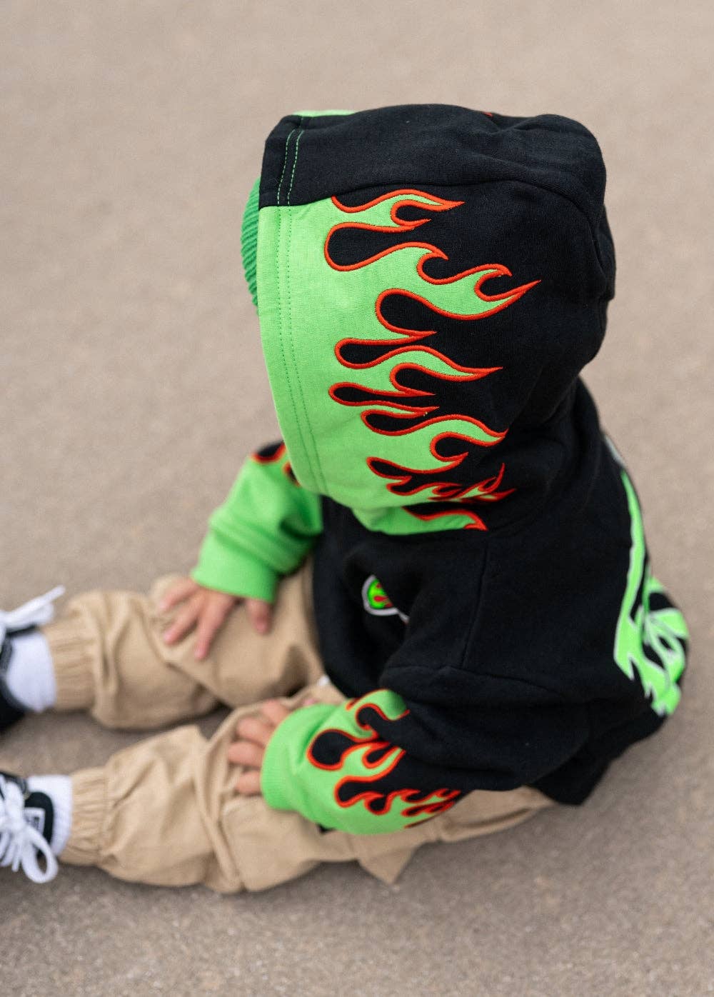 Fuel the Fun green flame hoodie for boys laid flat product view
