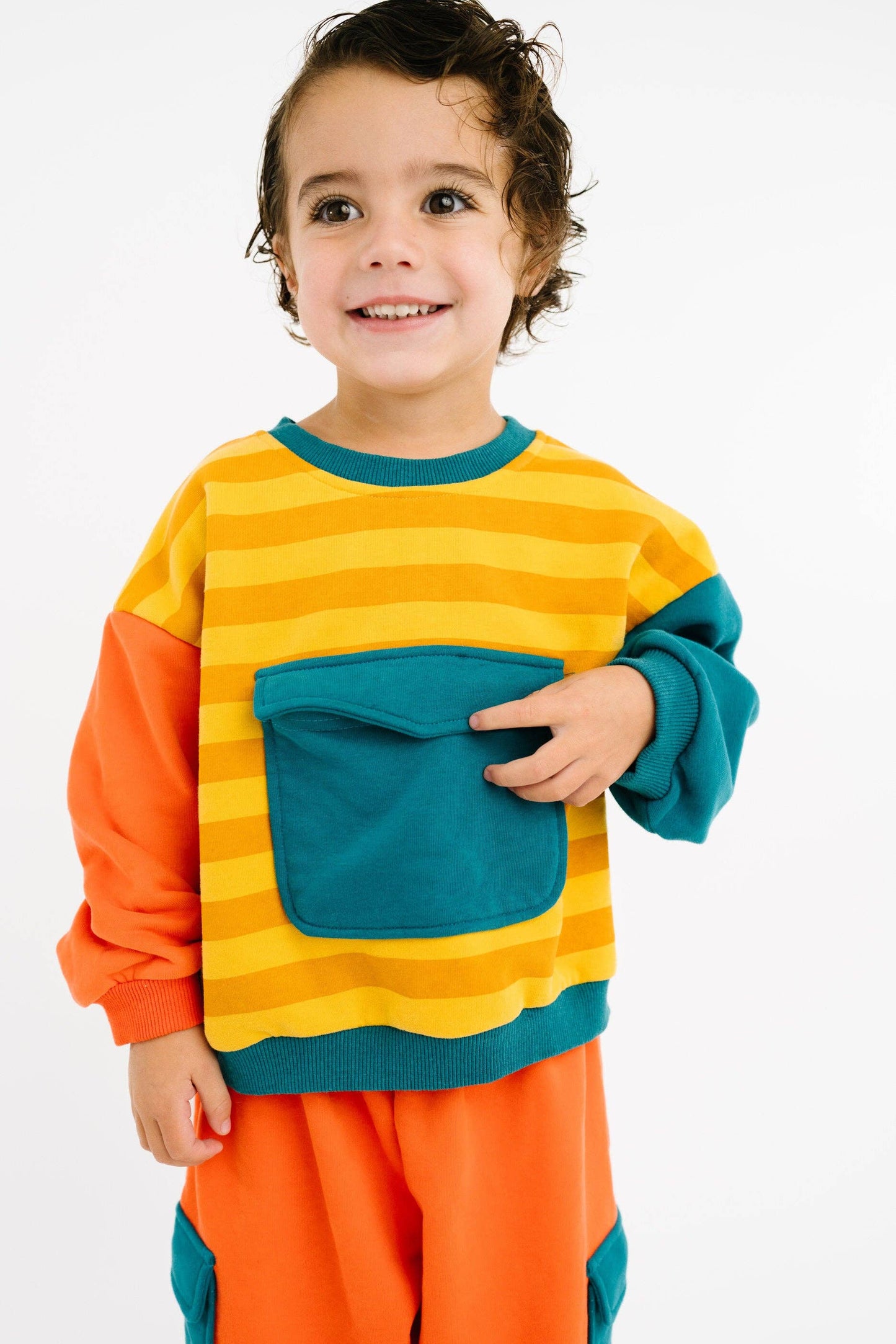 Bright retro kids boutique sweatsuit oversized fit worn full length view