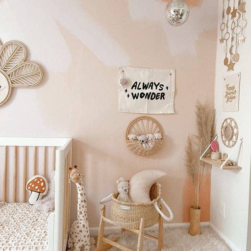 Inspirational Always Wonder canvas banner hung in kids room or classroom lifestyle view
