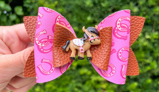 Horse and horseshoe hair bow for girls hot pink vegan leather 4 inch front view