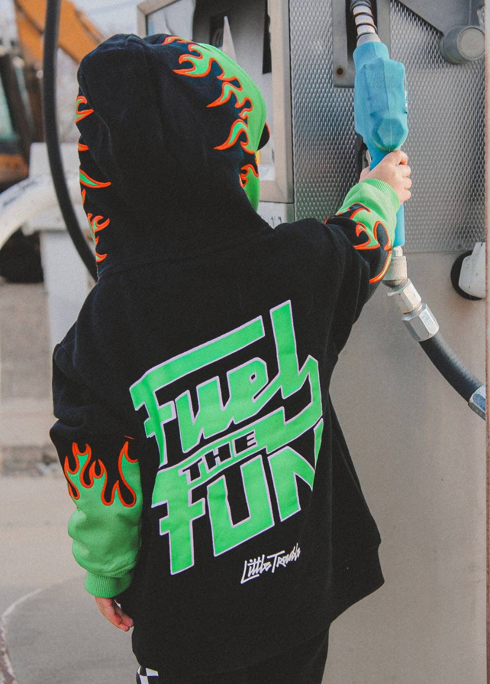Kids green flame hoodie with red embroidered edging and saturated green hood liner detail